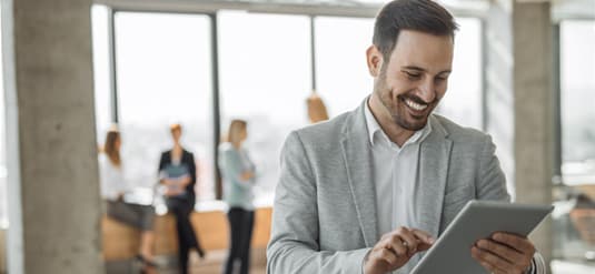 Purchasing professional reviewing course materials on a tablet